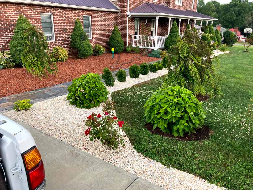 A house front yard improved with landscaping services