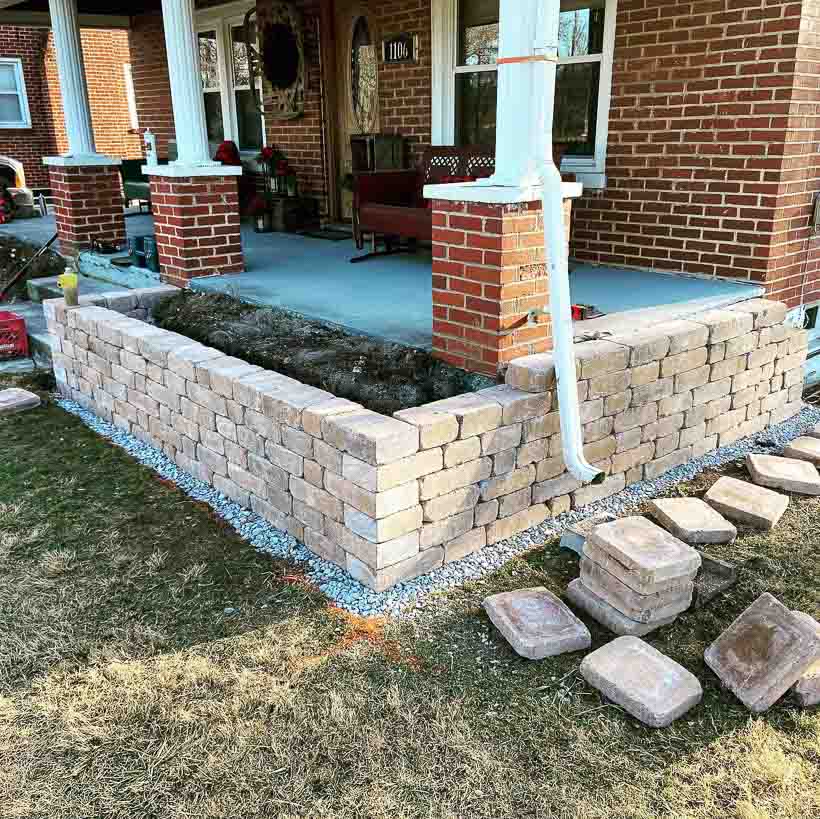 Hardscaping retaining wall in the front yard of a house